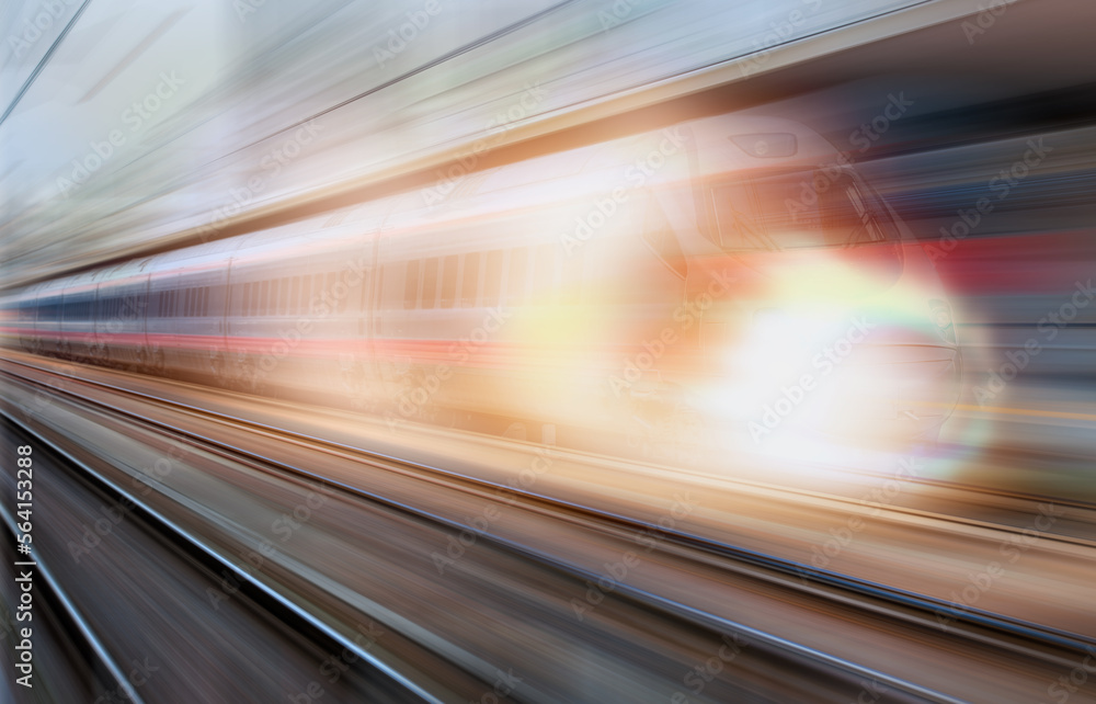 Wall mural blue high speed train runs on rail tracks - the train is going too fast as a result the air pressure