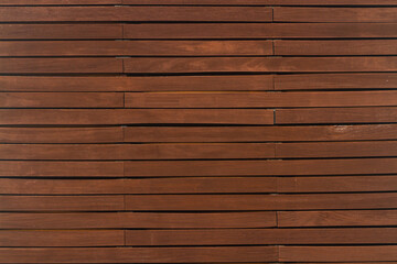 Obraz premium Close-up of a brown wooden wall painted a very long time and the paint peeled off. Brown texture background