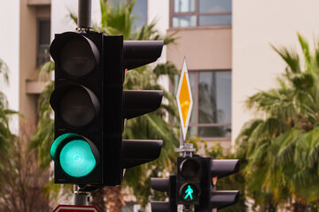 Traffic lights over urban intersection. Green light