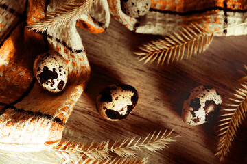 Quail eggs on wooden background. Happy Easter