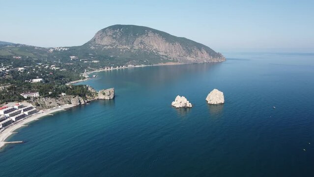 GURZUF, CRIMEA - Aerial View on the famous rocks Adalary, Two Twin-Cliffs with an edge of mountain Au-Dag in early spring morning at the South coast of Crimean Peninsula. Copy space.