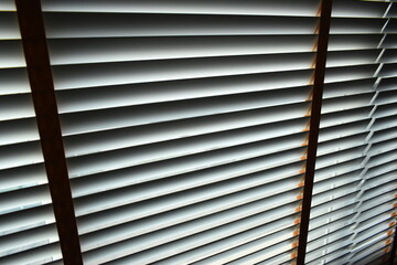 white blinds curtain put on the window, interior design
