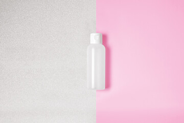 Clean empty bottle on a pink and silver background Valentine's Day photography mockup