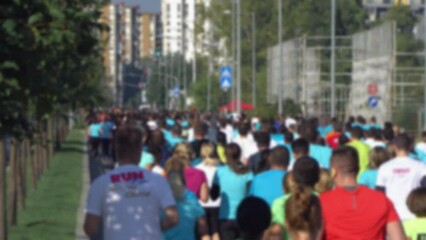 Defocused Marathon runners during race on sunny day