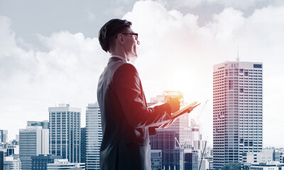 Concept of business success and control with confident boss against cityscape background