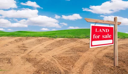 Foto op Canvas House symbol and land for sale signboard and empty dry cracked swamp reclamation soil, land plot for housing construction project with and beautiful blue sky with fresh air Land. © Gan