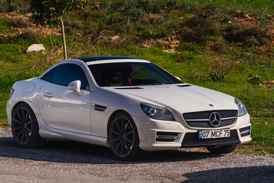 Side, Turkey -January 21, 2023:  white Mercedes SLK55 AMG   is parked  on the street on a warm summer day