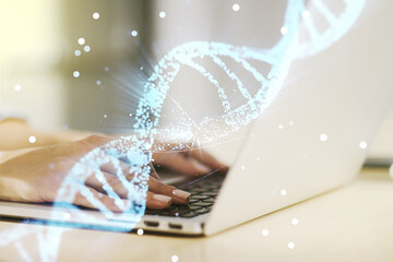 Creative DNA sketch and hands typing on computer keyboard on background, biotechnology and genetic concept. Multiexposure