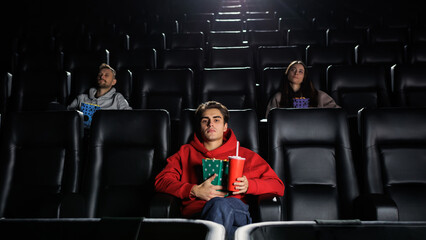 People watch movies in the cinema. Popcorn and soda. Leisure and entertainment