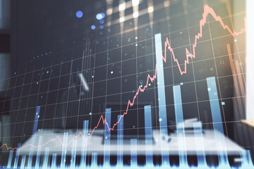 Abstract creative financial graph and modern desktop with computer on background, forex and investment concept. Multiexposure