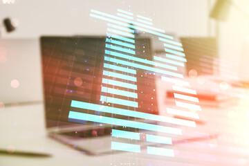 Double exposure of creative Bitcoin symbol with modern laptop on background. Cryptocurrency concept