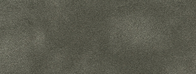 Texture of dark gray velvet matte background, macro. Suede fabric with black pattern.