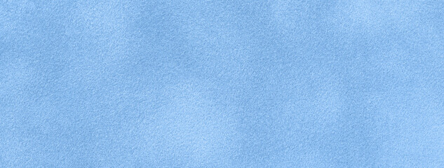 Texture of light blue velvet matte background, macro. Suede sky fabric with pattern.