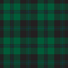 Green and black tartan plaid. Scottish pattern fabric swatch close-up. 