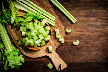 Sliced fresh celery on a cutting board. 