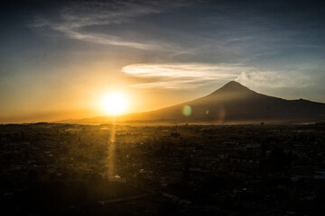 sunset over the vulcano in mexico