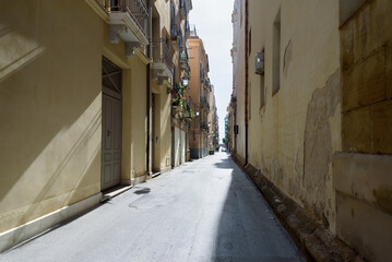 Fototapeta na wymiar Narrow street in Trapani.