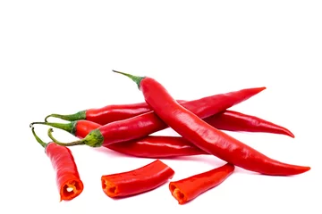 Fotobehang Red chili peppers with sliced isolated on white background. Ripe chili peppers with copy space. Raw food ingredient concept. © iBennn