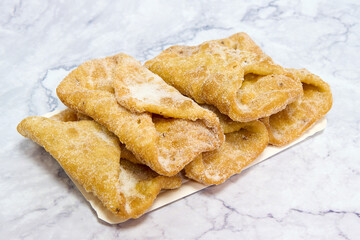 tray with homemade muffins on marble table