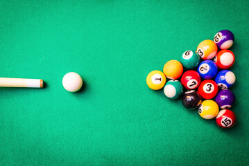 Cue aim billiard snooker pyramid on green table.Billiard balls on the green table with billiard...