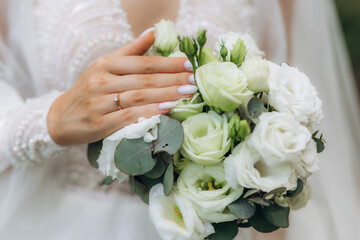 Obraz na płótnie Canvas Wedding bouquet of the bride. Wedding day. Happy bride. The bride's bouquet. Beautiful bouquet of white flowers. Beautiful flowers