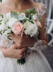 Wedding bouquet in bride's hands. beautiful wedding flowers.