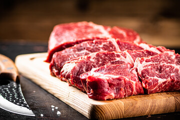 Chopped raw beef on a cutting board. 