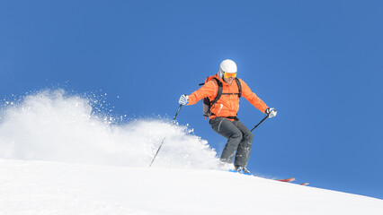 Fototapeta na wymiar Descent during ski mountaineering trip