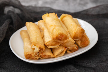 Spring Roll also known as Egg Roll on white dish