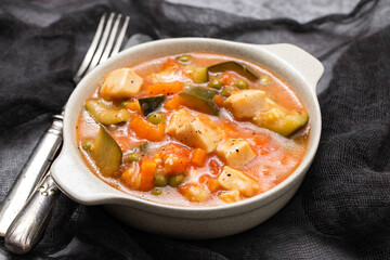 Delicious stew squid with vegetables in bowl