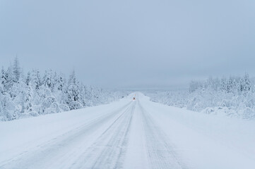 Fototapeta na wymiar winter in Lapland, snowy road
