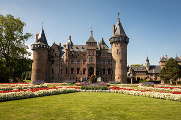 outside of Kasteel De Haar Dutch medieval castle with floral garden on sunny summer day. Flowers match colour of Utrecht Netherlands where historic building with European architecture is located
- 564208078