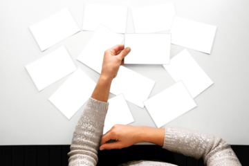 a woman looking at photos, remember nostalgia for a day of rest walking in the forest. Spring photo