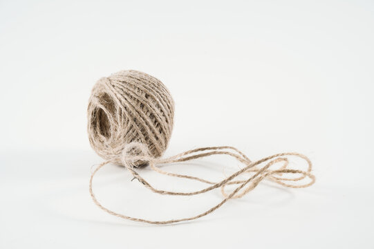 small ball of jute hemp string twine for all household and business tying tasks isolated on white