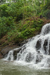 Uma Anyar waterfall, Bali, Indonesia. Jungle, forest, daytime with cloudy sky.