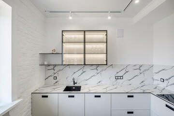 Interior of the modern luxure kitchen  in studio apartments in minimalistic style