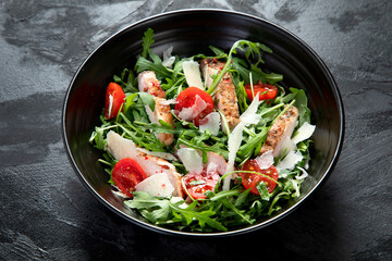 Chicken breast and fresh vegetable salad.