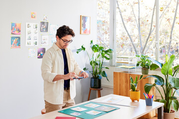 Man taking pictures of project in studio