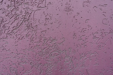 Irregular sirface of dusty purple wall with stucco worm finish