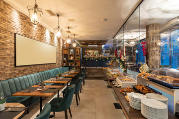 Restaurant interior with food buffet table