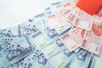 New Taiwan Dollar bill on white background. Red envelope packet chinese new year, hongbao on white background.