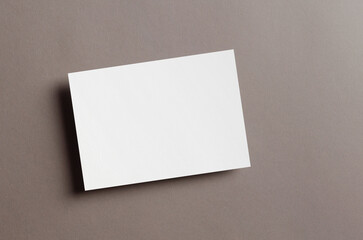 Blank invitation or greeting card mockup on paper background