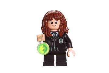 Fototapeta premium Russia Vyborg 01.22.2023 Lego figure Hermione Granger with goblet isolated on white background. Side view