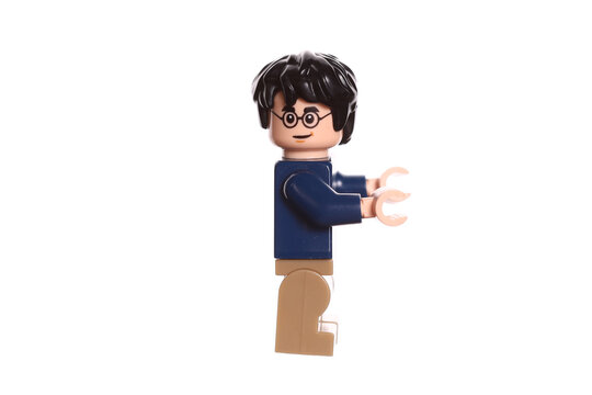 Russia Vyborg 01.22.2023 Harry Potter lego figurine with magic wand isolated on white background. Side view