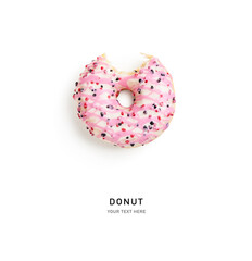 Pink bitten donut isolated on white background .