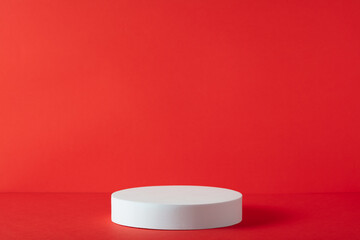 Abstract empty white podium on red background. Mock up stand for product presentation. 3D Render....