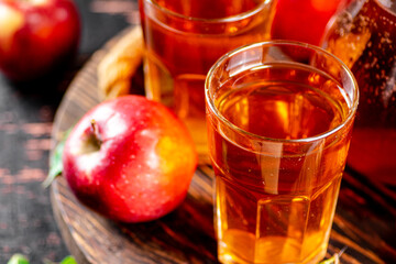Apple juice on a wooden tray. 