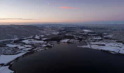 sunset over the mountains in southern norway during winter time