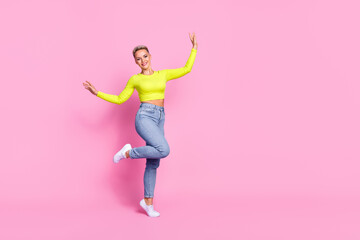Fototapeta na wymiar Full body photo of satisfied overjoyed lady raise hands enjoy chilling dancing empty space isolated on pink color background