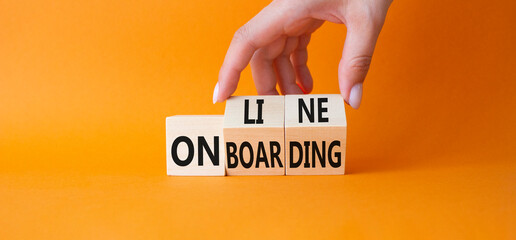 Online Onboarding symbol. Businessman Hand turns cubes with words Online Onboarding. Beautiful...